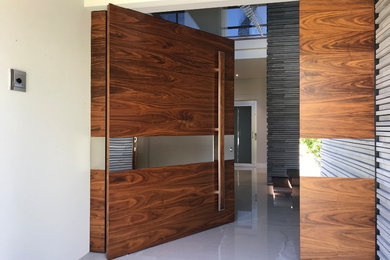 American Black Walnut pivot Door Concept, design and project byfinesse