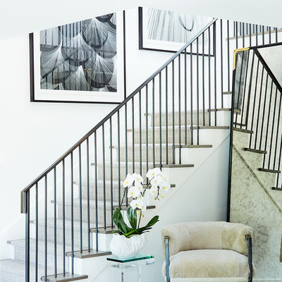 Example of a mid-sized transitional medium tone wood floor foyer design in Dallas with white walls