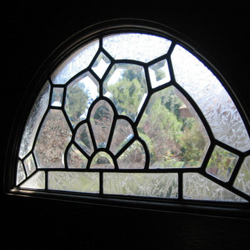 Arched window in door