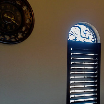 Arched Window with Wood Shutters and Tableaux Faux Iron
