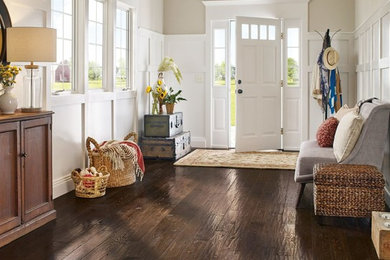Entryway - mid-sized traditional dark wood floor and brown floor entryway idea in Other with beige walls and a white front door