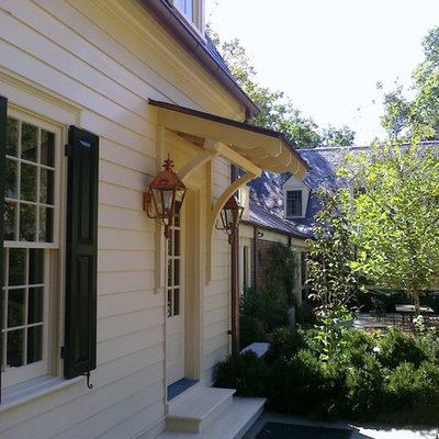 Arts and crafts single front door photo in Nashville with white walls