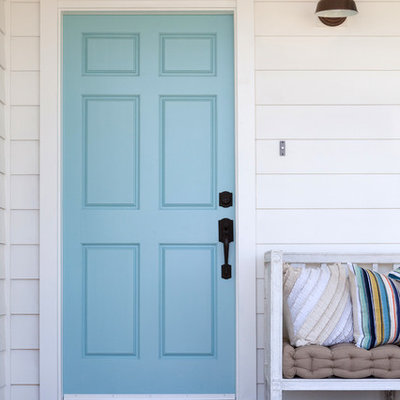 Entryway - large farmhouse entryway idea in Los Angeles with a blue front door