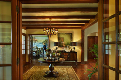 Inspiration for a timeless dark wood floor entryway remodel in Seattle with beige walls and a dark wood front door