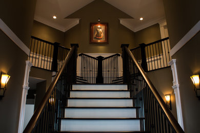 This is an example of a large contemporary foyer in Vancouver with brown walls, dark hardwood flooring, a double front door and a dark wood front door.