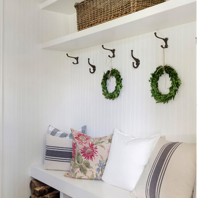 Example of a farmhouse gray floor mudroom design in Minneapolis with white walls