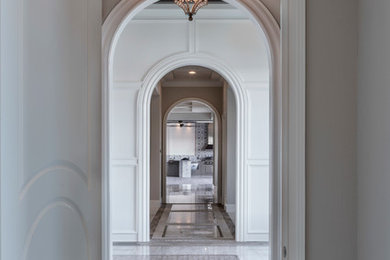 Inspiration for a transitional entryway remodel in Orlando with white walls
