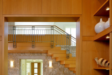 Foto de hall actual grande con paredes beige, suelo de piedra caliza, puerta simple y puerta de madera en tonos medios