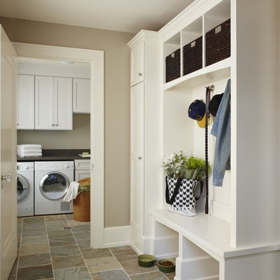 Inspiration for a mid-sized timeless slate floor and beige floor mudroom remodel in Detroit with beige walls