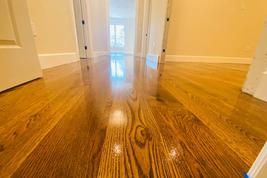 Large arts and crafts medium tone wood floor and brown floor foyer photo
