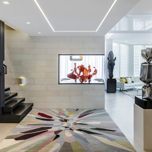 Trendy beige floor foyer photo in Miami with beige walls