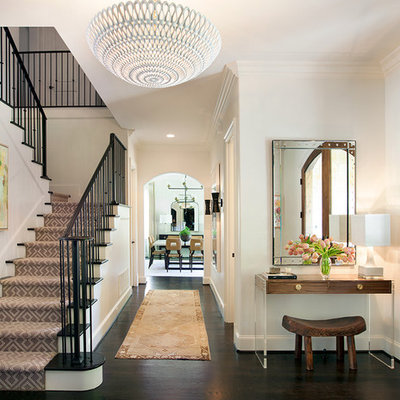 Inspiration for a mid-sized transitional dark wood floor foyer remodel in Dallas with white walls and a medium wood front door