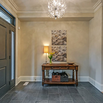 Example of a mid-sized classic slate floor and gray floor entryway design in Toronto with gray walls and a gray front door