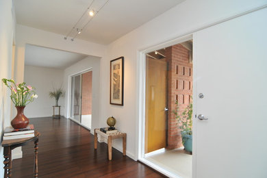 Entryway - mid-sized modern entryway idea in Phoenix with white walls and a white front door