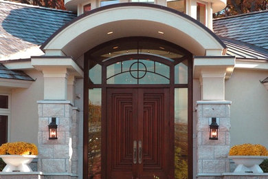 Elegant entryway photo in Minneapolis with a dark wood front door