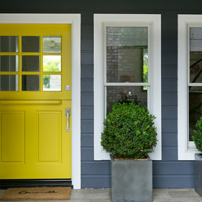 Transitional entryway photo in Orange County with a yellow front door