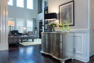 Inspiration for a mid-sized contemporary dark wood floor and brown floor foyer remodel in Columbus with gray walls