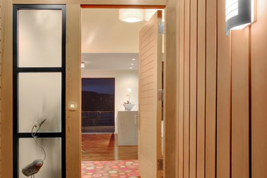 Example of a trendy entryway design in Seattle with a medium wood front door