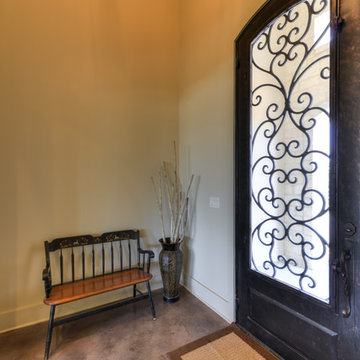 Charming Entry with wrought iron door with detailing