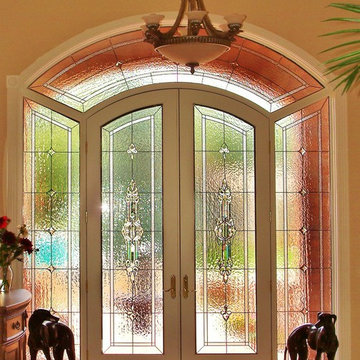 Classic beveled entryway with top arch and sidelights