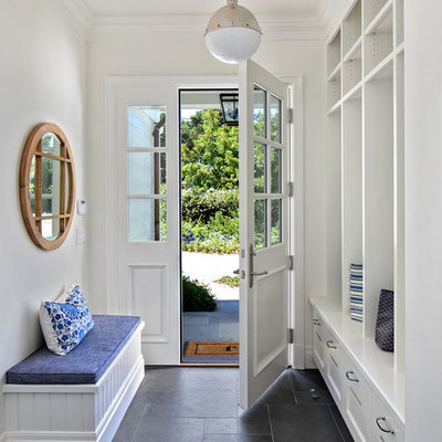 Elegant black floor entryway photo in San Francisco with white walls and a white front door