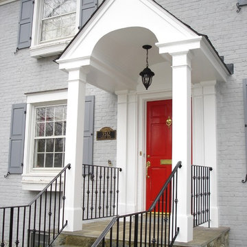 Classic White-Columned Portico and Wrought Iron Handrail
