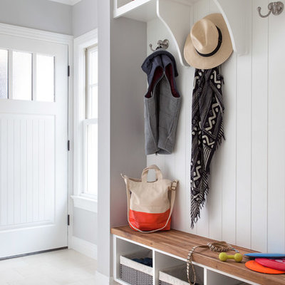 Entryway - traditional entryway idea in Austin with gray walls and a white front door