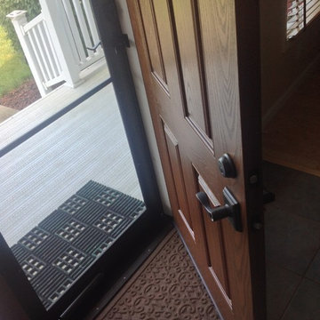 Close up of fiberglass door and aluminum storm door in a Columbus Ohio farmhouse