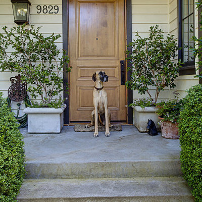 Entryway - traditional entryway idea in Seattle with a medium wood front door