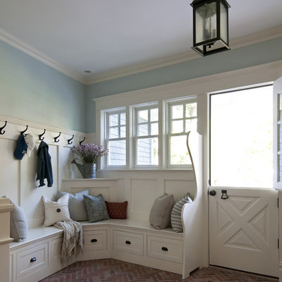 Inspiration for a timeless brick floor dutch front door remodel in Newark with a white front door