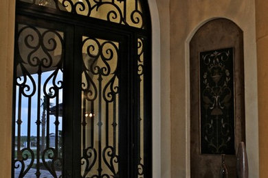 Tuscan entryway photo in Austin