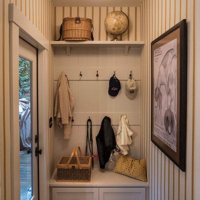 Example of a small classic entryway design in Portland with multicolored walls and a glass front door