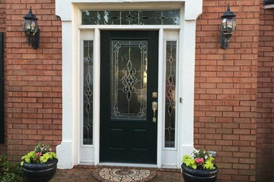 Entryway - large transitional entryway idea in Atlanta with a black front door