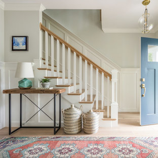 Inspiration for a country light wood floor and beige floor foyer remodel in Boston with gray walls and a blue front door