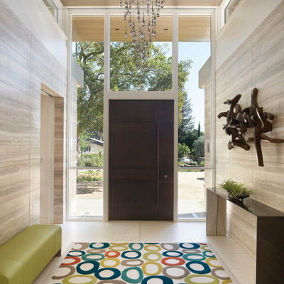 Inspiration for a mid-sized contemporary entryway remodel in San Francisco with multicolored walls and a metal front door