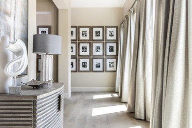Design ideas for a large contemporary foyer in Sacramento with grey walls and grey floors.