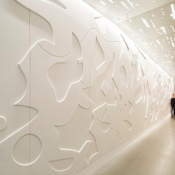 Corridor showing custom CNC milled relief wall panels