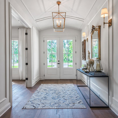 Transitional dark wood floor entryway photo in Jacksonville with white walls and a white front door