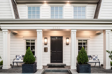 Inspiration for a timeless entryway remodel in Salt Lake City with a black front door