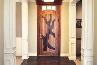 Entryway - modern dark wood floor entryway idea in Columbus