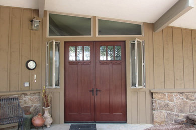 Design ideas for a medium sized classic front door in Denver with a double front door and a dark wood front door.