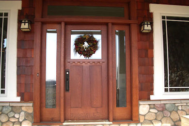 Example of a large arts and crafts entryway design in Detroit