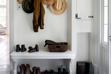 Inspiration for a farmhouse entryway remodel in New York
