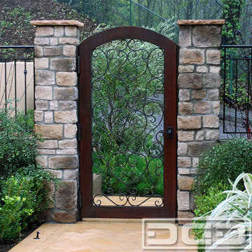 Custom Mediterranean Style Passage Gates With Iron-Forged Scrolling & Wood Frame