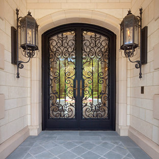 Custom ornate wrought iron / glass front entry door / Gas Lanterns.
