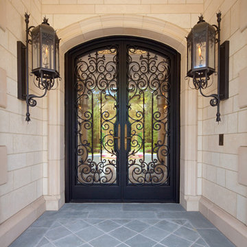 Custom ornate wrought iron / glass front entry door / Gas Lanterns.