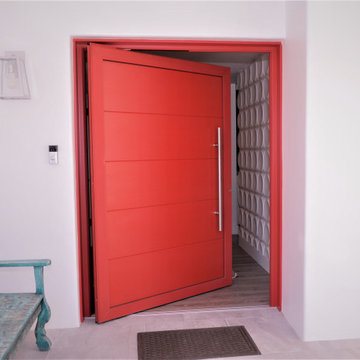 Custom Red Statement Pivot Entry Door