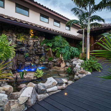 Custom Rock Waterfall Pool with Stone Grotto, Stream and Tiki Hut