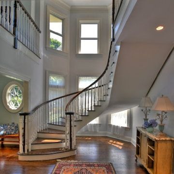 Custom Victorian-style home - inerior curved stair