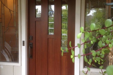 Example of a large classic entryway design in San Francisco with a medium wood front door